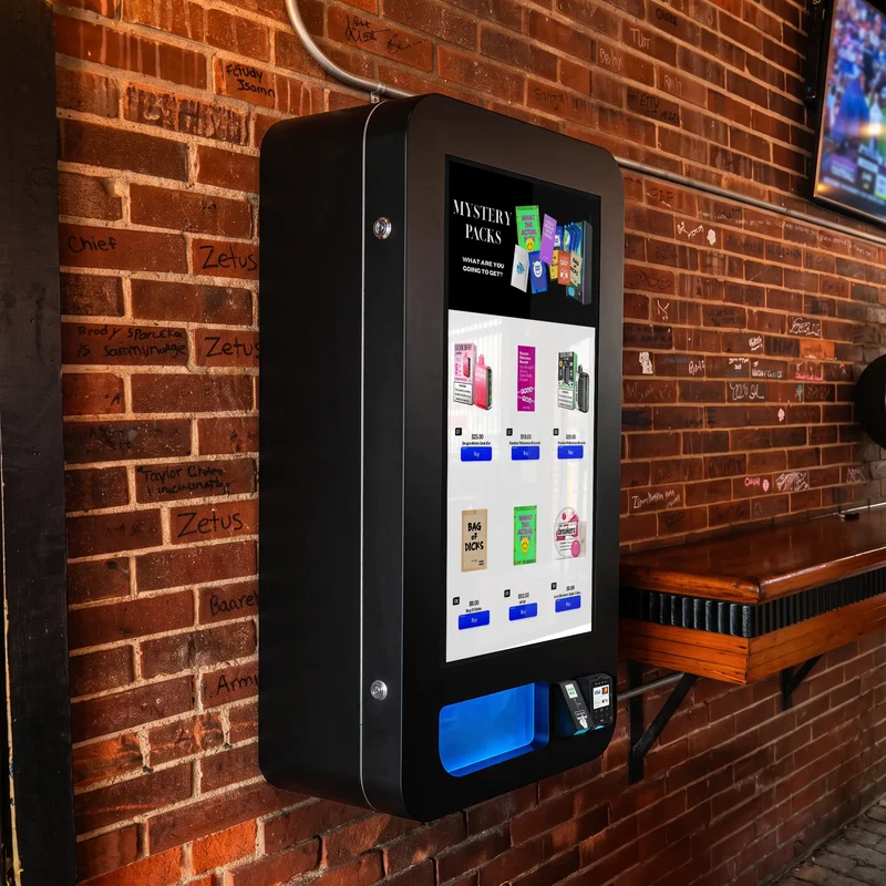 Wall-mounted mystery pack vending kiosk at a bar